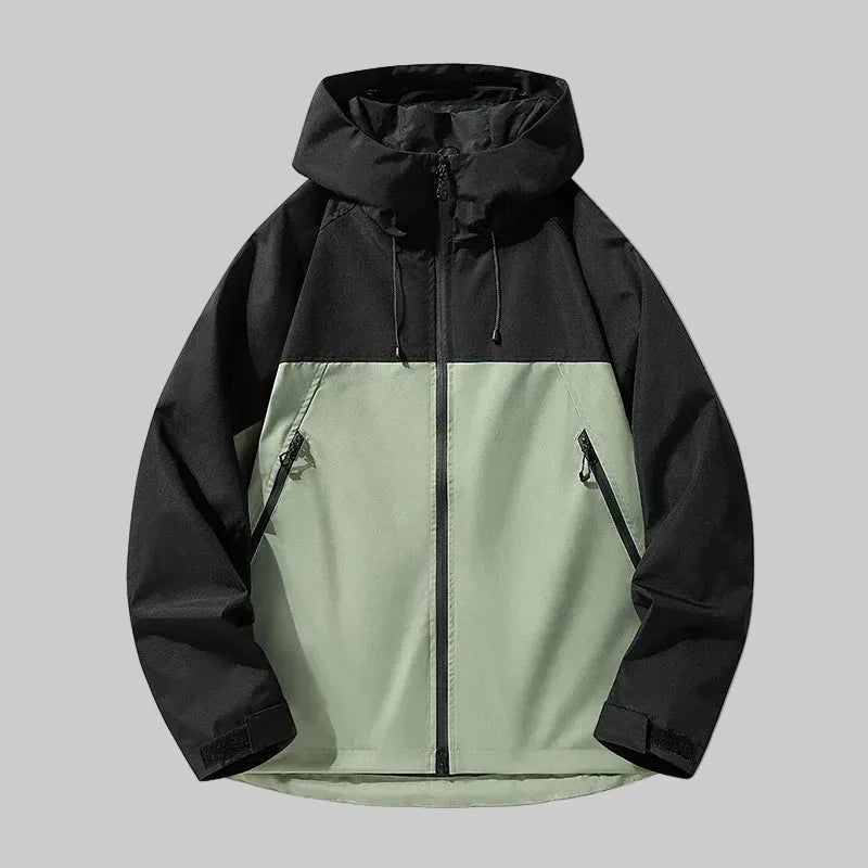Green and black colour-block hooded jacket, front view, showing two-tone panelling and drawstring hood