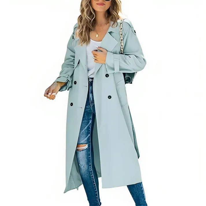 Light blue double-breasted trench coat with a relaxed silhouette, shown open with a matching belted waist.