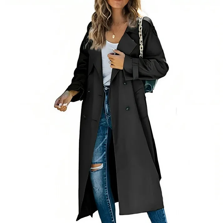 Black double-breasted trench coat with classic lapel and button placket, worn as an open outer layer.