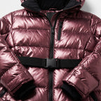 Close-up of the front zip, chest pocket and black buckle waist belt on the metallic burgundy puffer jacket