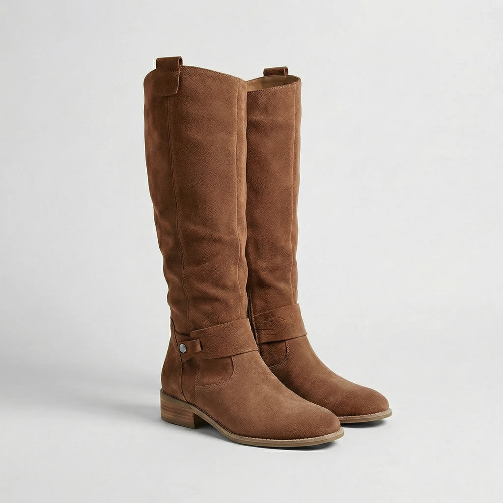 Pair of brown suede-look knee-high boots with gathered shaft, stitched buckle strap and stacked heel, side view