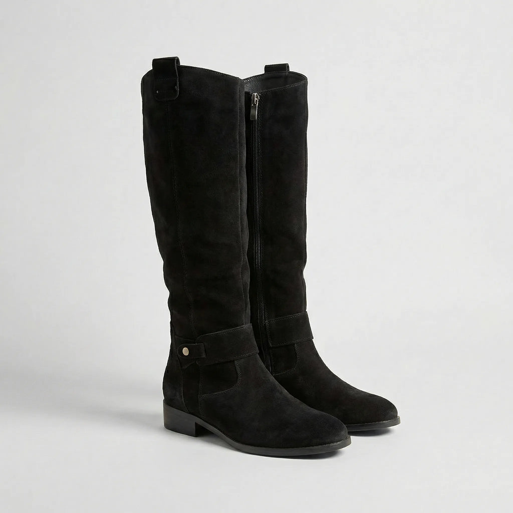 Pair of black suede-look knee-high boots with side zip, buckle strap and low block heel, front angle