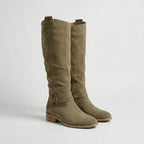 Pair of khaki green suede-look knee-high boots with slouchy shaft and buckle strap detail, side angle