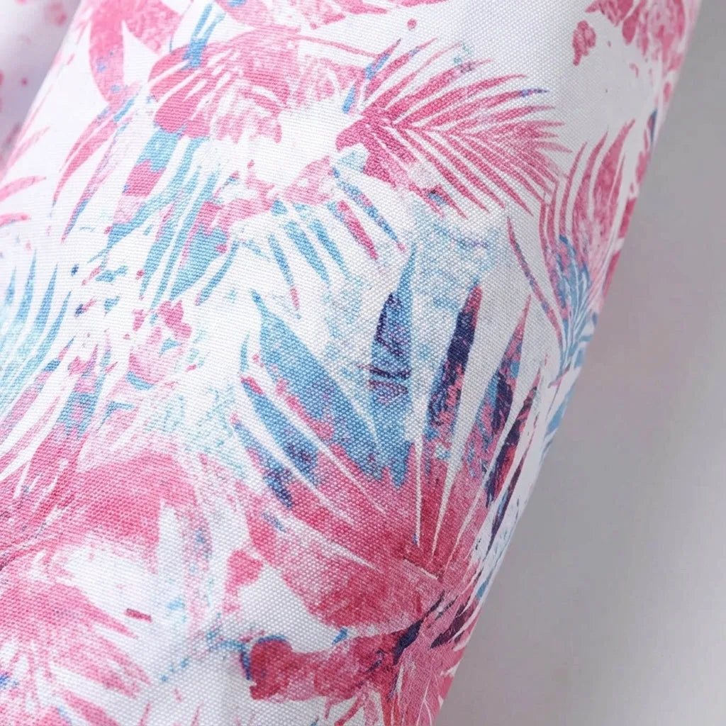 Close-up of the pink, blue and purple palm leaf print fabric showing the woven texture
