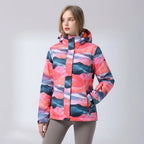 Model looking sideways wearing the pink floral print jacket, showing the stand collar and hood