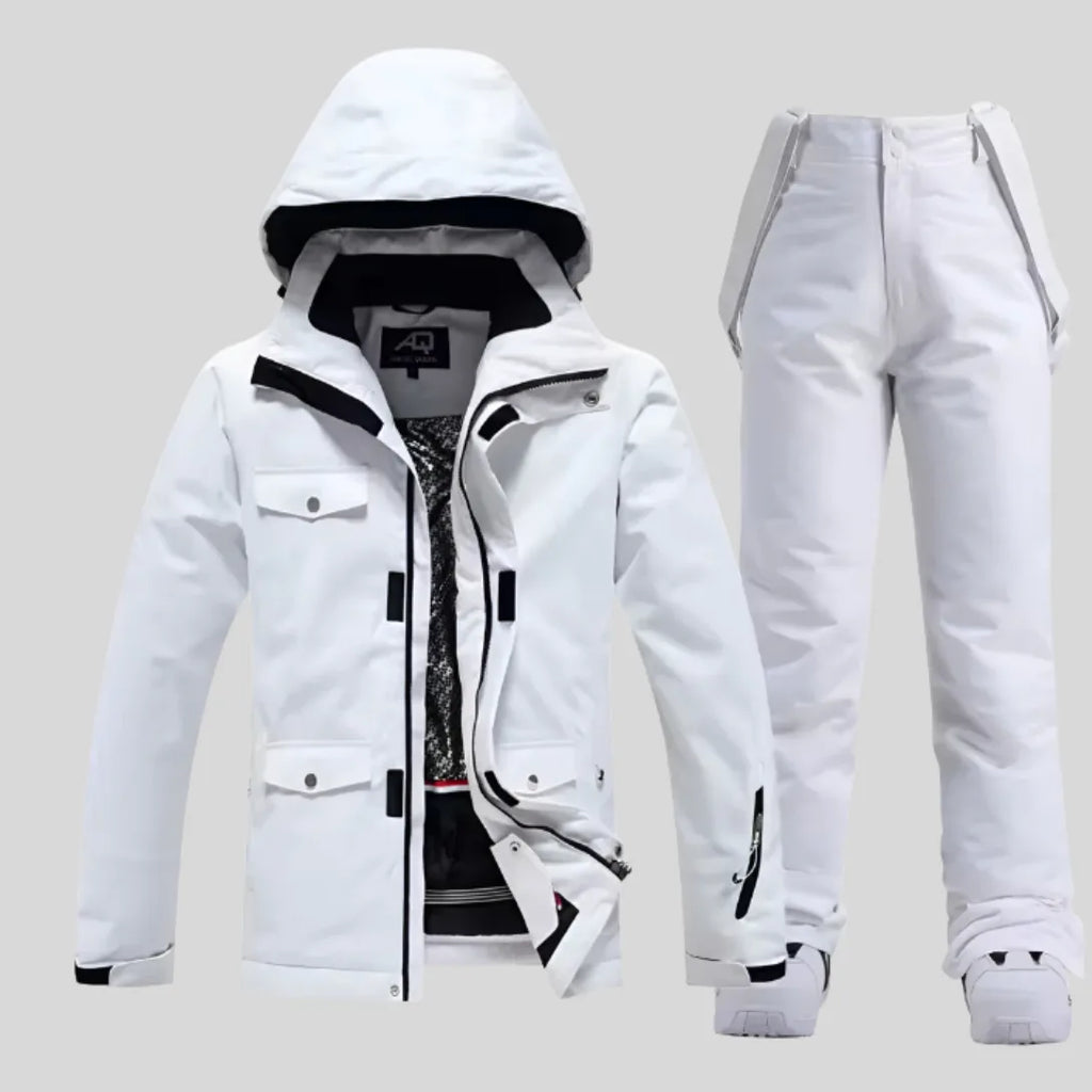 Women's white ski jacket and matching white trousers, front view with hood up and jacket unzipped showing patterned lining