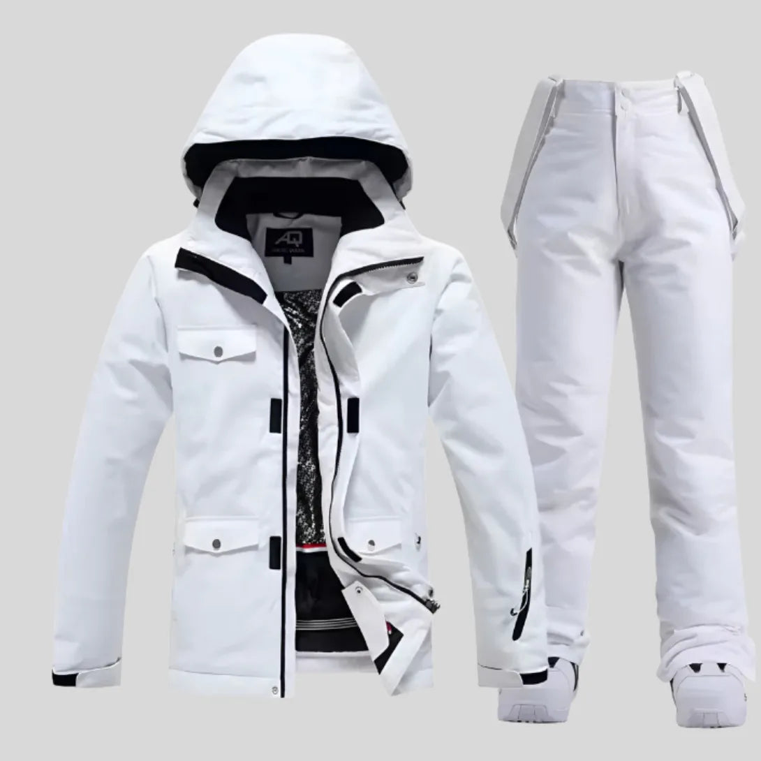 Women's white ski jacket and matching white trousers, front view with hood up and jacket unzipped showing patterned lining
