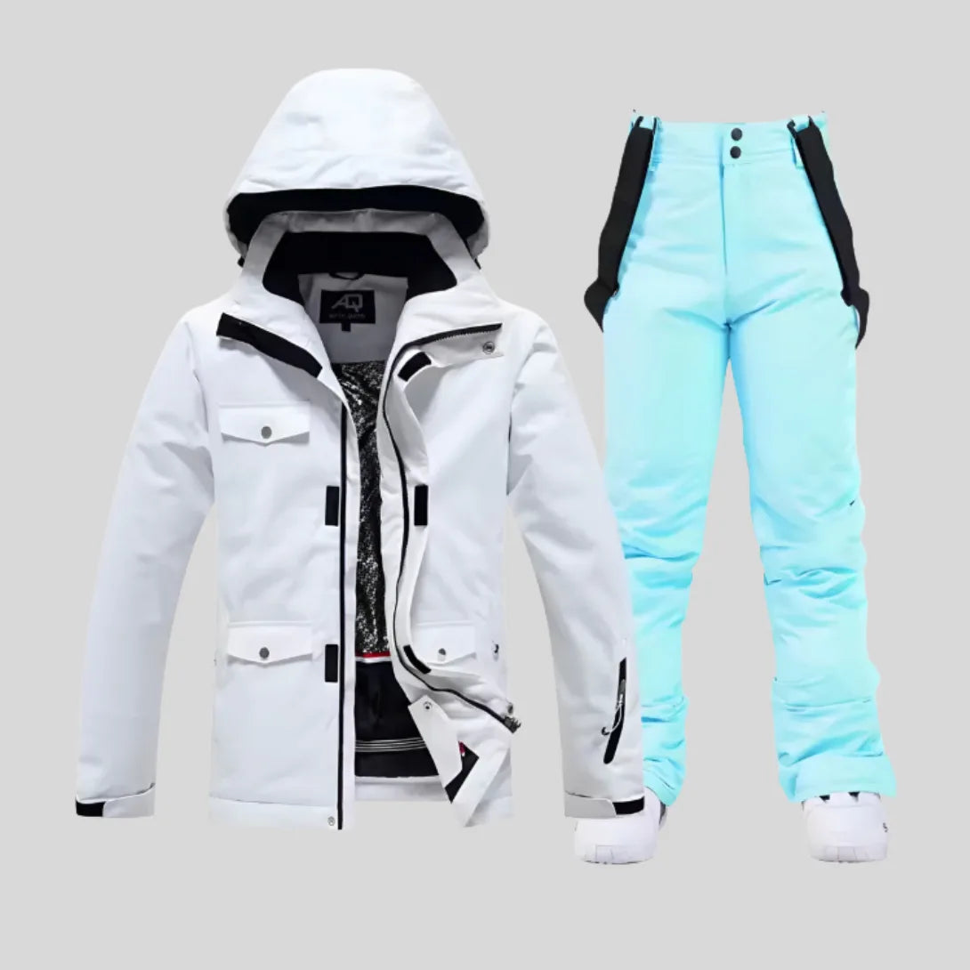 White hooded ski jacket matched with pale blue bib trousers and white trainers