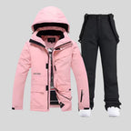 White hooded ski jacket matched with marled grey bib trousers for a two-tone look
