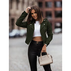 Model wearing an olive green suede cropped jacket with lapel collar and silver zip hardware