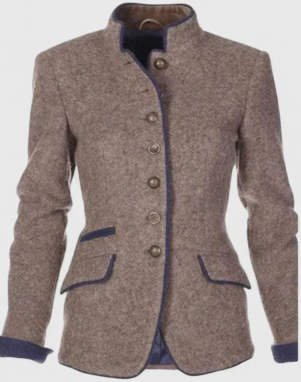 Beige wool-blend blazer laid flat, showing stand collar, navy piping, flap pockets and button front