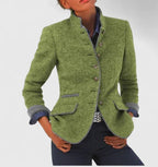 Green wool-blend blazer with grey piped trim, stand collar and flap pockets with contrast binding