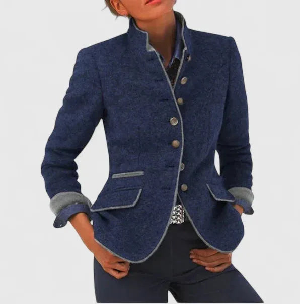 Navy wool-blend blazer with grey contrast trim, stand collar and turned-back cuffs worn with dark trousers