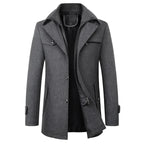 Charcoal grey mid-length coat with knitted collar, front zip and button placket, side pockets visible