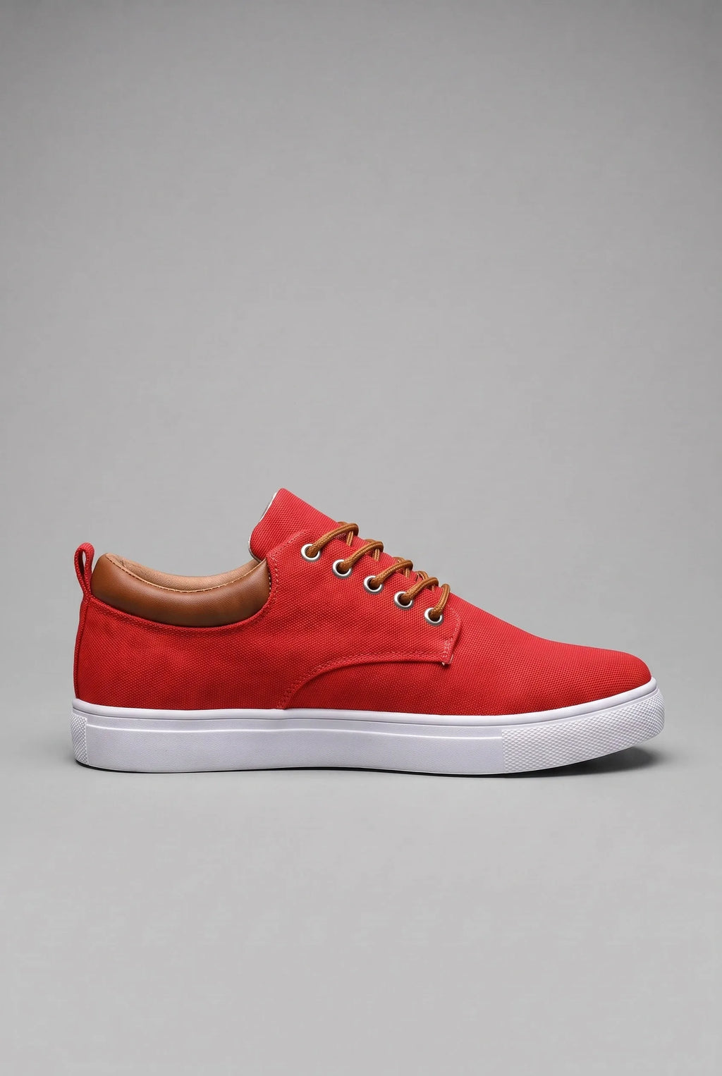 Side profile of red woven trainer with tan leather heel tab and white cupsole