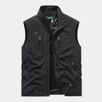Black sleeveless zip gilet with stand-up collar, front zip pockets and mesh lining visible inside