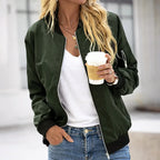 Close-up front view of a khaki green zip-up bomber jacket worn over a white top, ribbed collar and cuffs visible