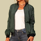 Front detail view of a khaki green bomber jacket showing the zip pull, ribbed collar and sleeve zip pocket